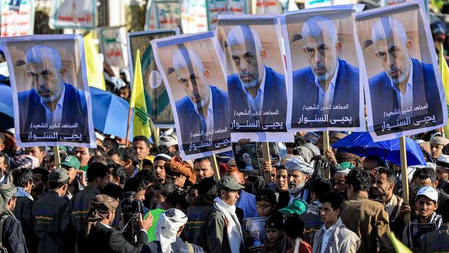 Supporters of Yemen's Huthis gather with pictures of Hamas' slain leader Yahya Sinwar during a rally in Sanaa. Picture: AFP.