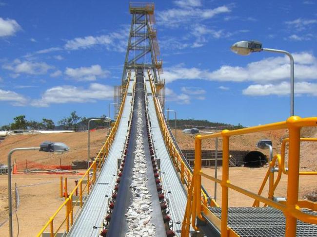 Evolution Mining, - Conveyor belt loaded with commissioning ore at Mt Carlton between Charters Towers and Bowen.