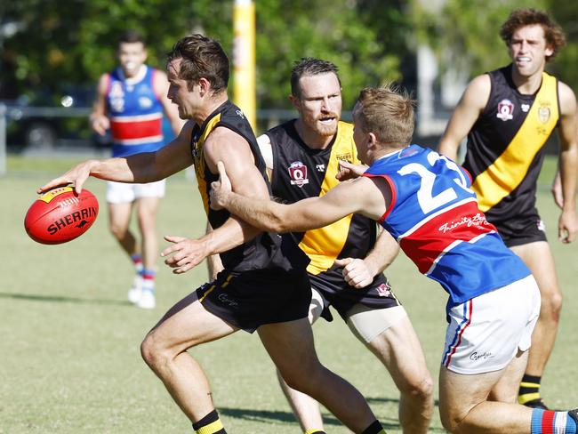 Tigers' Daniel Jackson clears the ruck in the AFL Cairns men's premiership match between the North Cairns Tigers and the Central Trinity Beach Bulldogs, held at Watson's Oval Manunda. Picture: Brendan Radke