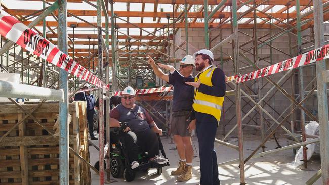 Ready to move: Logan’s Brendon Woolf, Steve Soberon from Opalyn Constructions and Cr Tony Hall inspect the Neridah St building site.