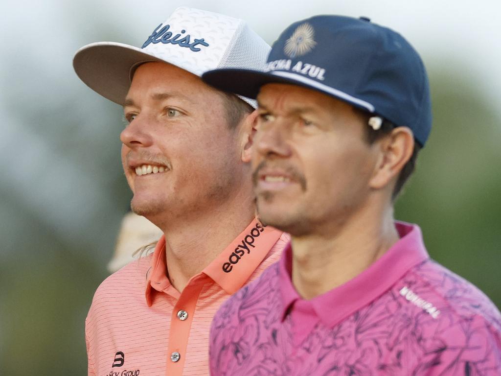 HONOLULU, HAWAII - JANUARY 12: Mark Wahlberg (R) and Cameron Smith (L) from Australia go through the 11th hole during the Pro-Am tournament before the Sony Open starts in Hawaii at the Waialae Country Club on January 12, 2022 in Honolulu, Hawaii.  (Photo by Cliff Hawkins / Getty Images)
