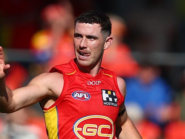 GOLD COAST, AUSTRALIA - AUGUST 17: Sam Flanders of the Suns celebrates a goal during the round 23 AFL match between Gold Coast Suns and Melbourne Demons at People First Stadium, on August 17, 2024, in Gold Coast, Australia. (Photo by Chris Hyde/Getty Images)