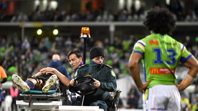 Iosia Soliola of the Raiders watches Billy Slater of the Storm being stretchered off during the Round 20 NRL match between the Canberra Raiders and the Melbourne Storm at GIO Stadium in Canberra, Saturday, July 22, 2017. (AAP Image/Mick Tsikas) NO ARCHIVING, EDITORIAL USE ONLY