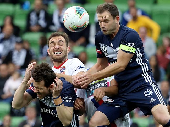 Leigh Broxham of Melbourne Victory (right) flies high to head the ball. Picture: Jonathan DiMaggio/Getty Images