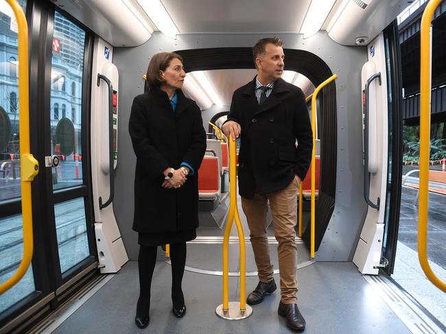 Premier Gladys Berejiklian and Transport Minister Andrew Constance (right) with the first tram to reach Circular Quay during it's testing phase in Sydney. Picture: AAP Image/Dean Lewins