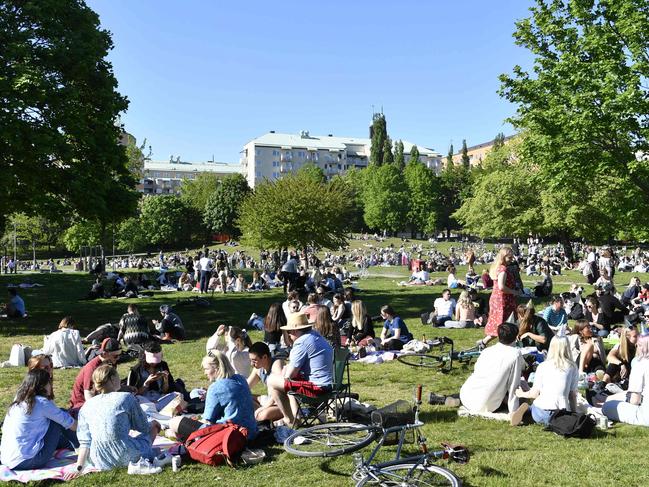 People enjoy the sunny weather in Tantolunden park in Stockholm on May 30, 2020, amid the novel coronavirus pandemic. (Photo by Henrik MONTGOMERY / TT News Agency / AFP) / Sweden OUT