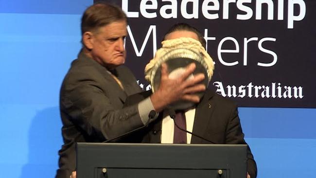 Alan Joyce has a pie pushed in his face by Tony Overheu. If this offended you, you should also be offended by the attack on Andrew Bolt. (Pic: Supplied)