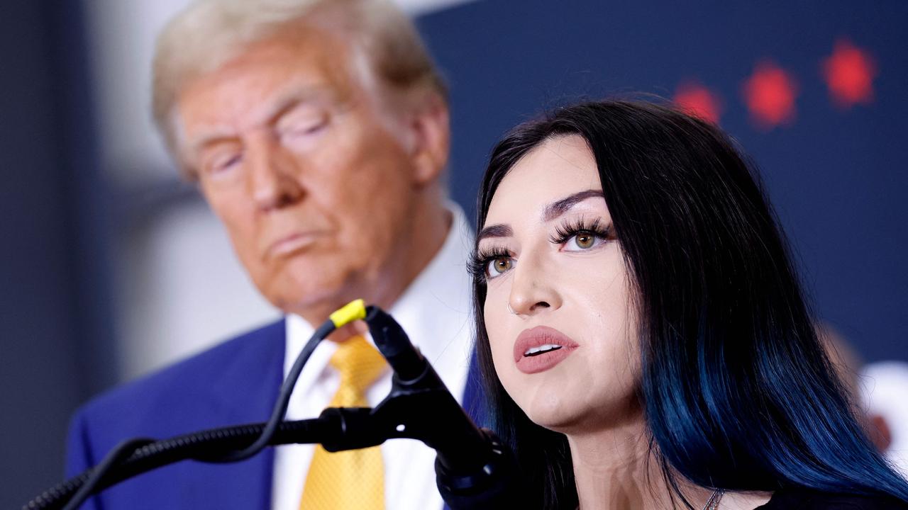 Republican presidential nominee, former U.S. President Donald Trump, listens as Alexis Nungaray talks. Picture: Getty