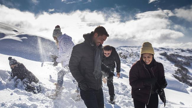 Brazilian nationals Eric Alkema 34, and Isamar Fontes, 28 with friends at Eagle’s Nest, Thredbo, ahead of the ski season on Monday. Picture: Sean Davey