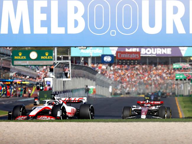 Haas' Danish driver Kevin Magnussen leads a pack of cars during the 2022 Formula One Australian Grand Prix at the Albert Park Circuit in Melbourne on April 10, 2022. (Photo by Con Chronis / AFP) / -- IMAGE RESTRICTED TO EDITORIAL USE - STRICTLY NO COMMERCIAL USE --