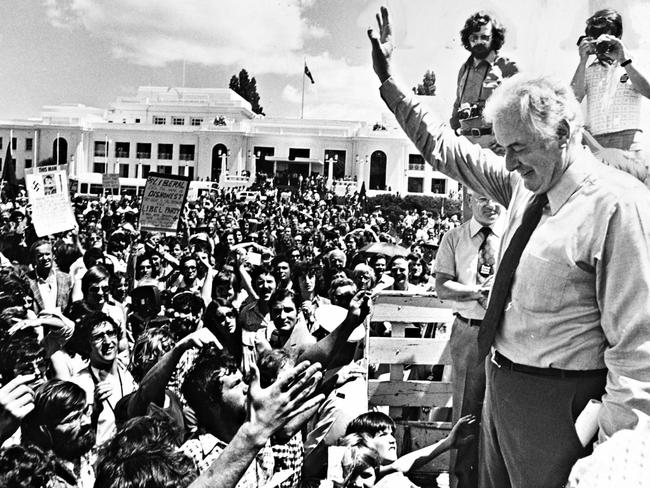 Ousted PM Gough Whitlam outside federal parliament in Canberra on November 12, 1975, waving to supporters a day after his dismissal. Picture: Ross Duncan