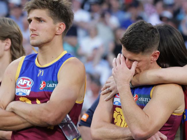 Dayne Zorko is comforted by partner Talia De Marco after the siren at the 2023 AFL Grand Final where Collingwood defeated the Brisbane Lions by 4 points at the MCG. Picture Lachie Millard