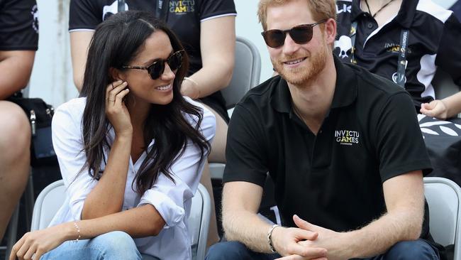 Meghan Markle in ‘The Husband’ shirt with Prince Harry in 2017. Picture: Chris Jackson/Getty/AFP