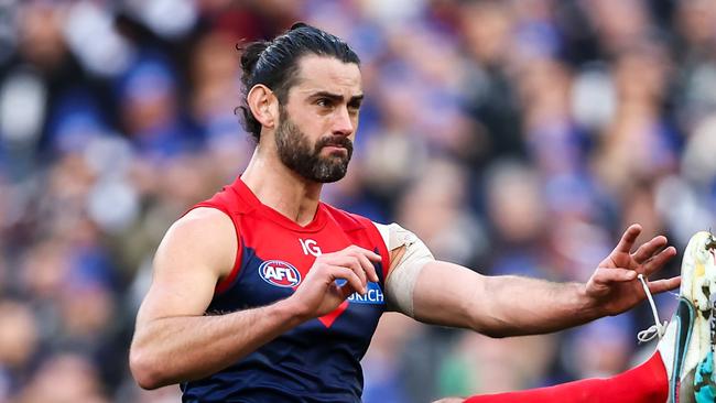 MELBOURNE, AUSTRALIA - JUNE 12: Brodie Grundy of the Demons kicks the ball during the 2023 AFL Round 13 match between the Melbourne Demons and the Collingwood Magpies at the Melbourne Cricket Ground on June 12, 2023 in Melbourne, Australia. (Photo by Dylan Burns/AFL Photos via Getty Images)