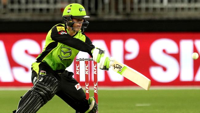 Matthew Gilkes slashes at a wide ball during his BBL debut last season.