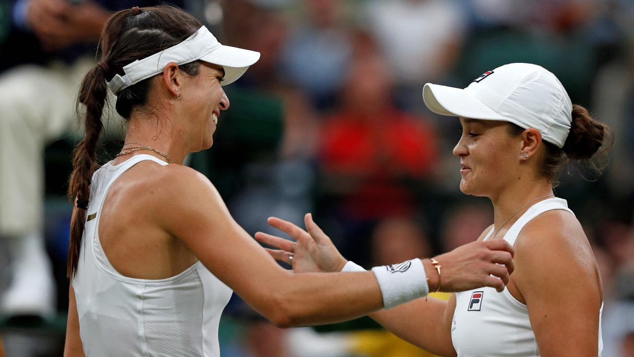 Ajla Tomljanovic (left) meets Ash Barty at the net after their all-Australian Wimbledon quarter-final last year. Picture: AFP
