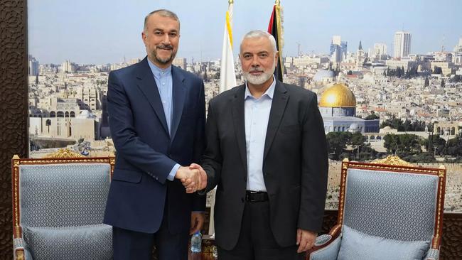 Iranian Foreign Minister Hossein Amir Abdollahian, left, greets Hamas' political bureau chief Ismail Haniyeh in Doha on October 31. Picture: AFP