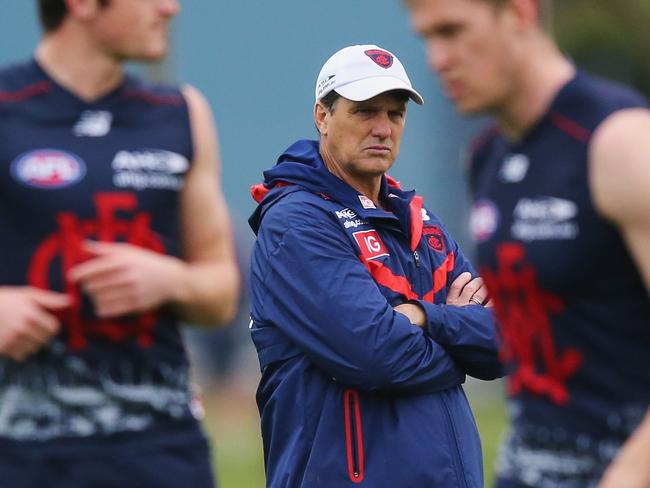 MELBOURNE, AUSTRALIA - JULY 07: Demons head coach Paul Roos keeps a watchful eye on players during a Melbourne Demons AFL training session at AAMI Park on July 7, 2016 in Melbourne, Australia. (Photo by Michael Dodge/Getty Images)