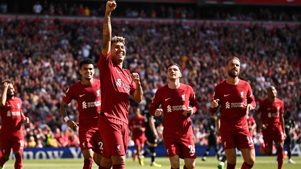 Liverpool's Brazilian striker Roberto Firmino celebrates after scoring their fourth goal. Photo by Oli SCARFF / AFP.