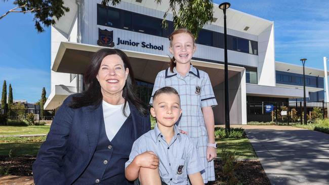 NEWS ADVWoodcroft College principal Shannon Warren with students Phoenix Cutajar 6yr and Jana Nel 9Woodcroft College opened a new junior campus 12 months ago to address overcrowding issues. -Image/Russell Millard Photography