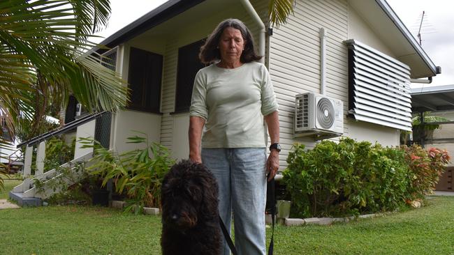 Barbara Williams with her dog Colin at the front of her home at Talbot Estate.