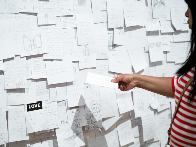 Visitor participating in Yoko Ono’s My Mommy is Beautiful at the NGV. Picture: Liana Hardy