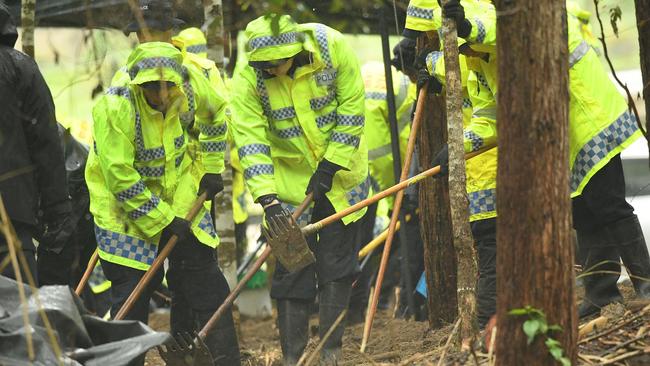 Officers scraping through the dirt. Picture NCA NewsWire / Trevor Veale