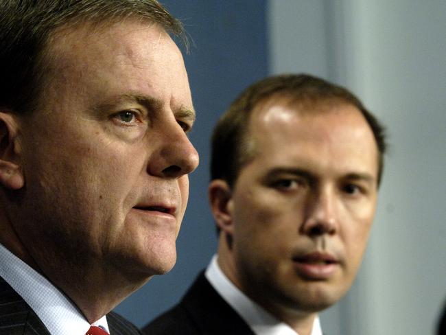 Treasurer Peter Costello (left) and Assistant Treasurer Peter Dutton speak to the media during a press conference in Canberra, Tuesday, Sept. 5, 2006. Treasurer Costello announced the details of transitional rules governing changes to superannuation that aim to cut tax on end benefits, the government proposes to bring in the changes next July. (AAP Image/Alan Porritt) NO ARCHIVING