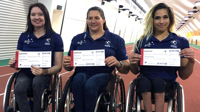 Wheelchair sprinter Angie Ballard (left) with coach Louise Sauvage and fellow Paralympic athlete Madison de Rozario (right) at the announcement of the 44-strong Paralympic athletics team at the Australian Institute of Sport in Canberra on Tuesday.