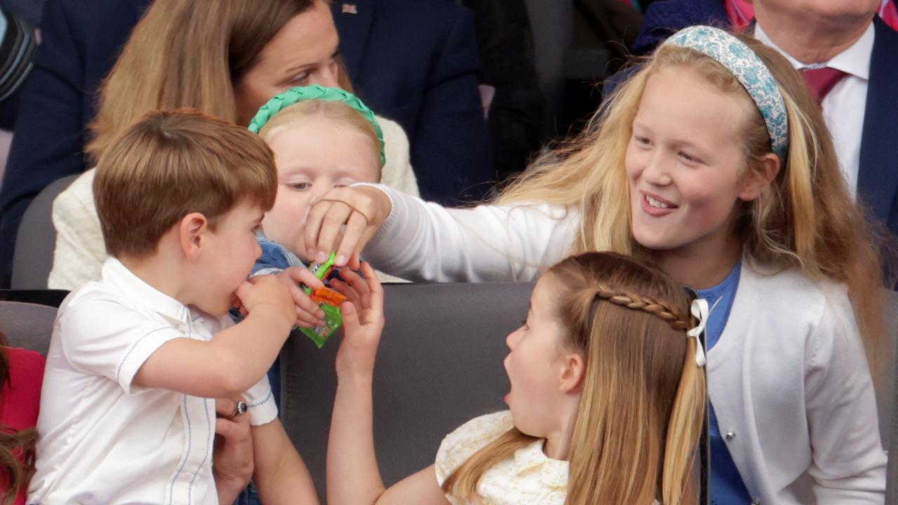 Charlotte and brother Louis eagerly grab a snack during the show. Picture: Chris Jackson/WPA/Getty Images