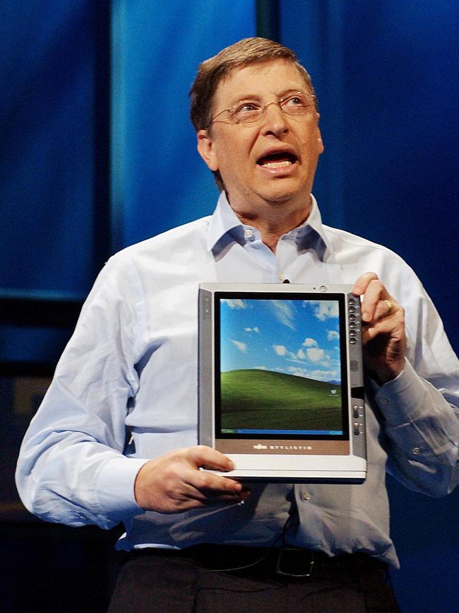 Bill Gates holds a Tablet PC in 2002.