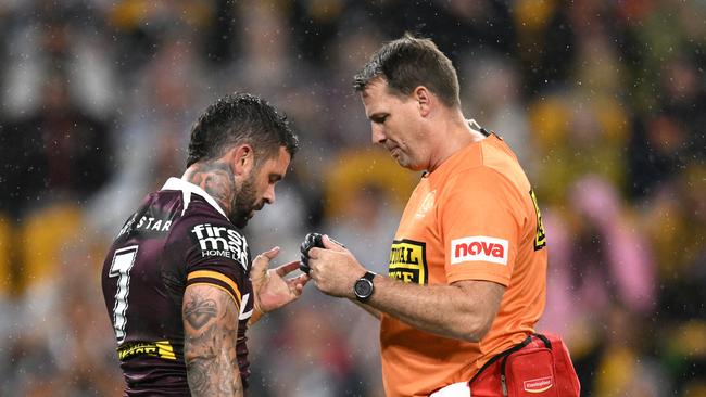 Adam Reynolds receives treatment on field during match against the Bulldogs.
