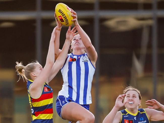 Emma King climbs highest to mark for North Melbourne. Picture: Dylan Burns/AFL Photos via Getty Images