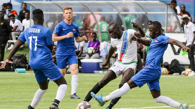 Action between South Sudan (white kits) and Sudan during the African Nations Cup at Angle Park. Picture: AAP Image/Russell Millard