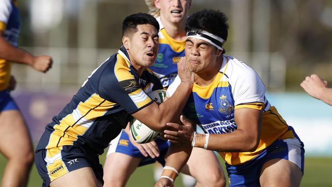 Westfields SHS player hits the line hard during the NRL Schoolboy Cup grand final rematch against Patrician Brothers Blacktown. Picture: Jonathan Ng