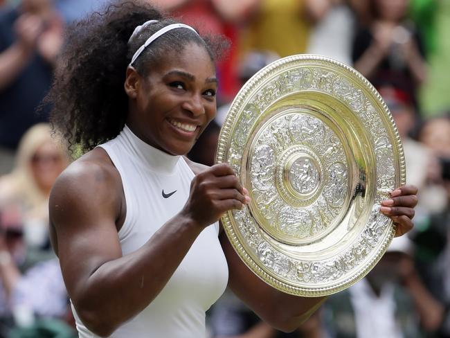 Serena Williams holds up the trophy after beating Angelique Kerber of Germany in the women's singles final.