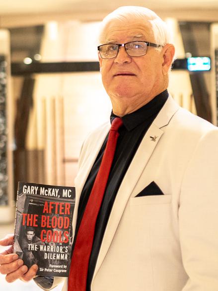 McKay with his new book, After the Blood Cools: The Warrior's Dilemma.