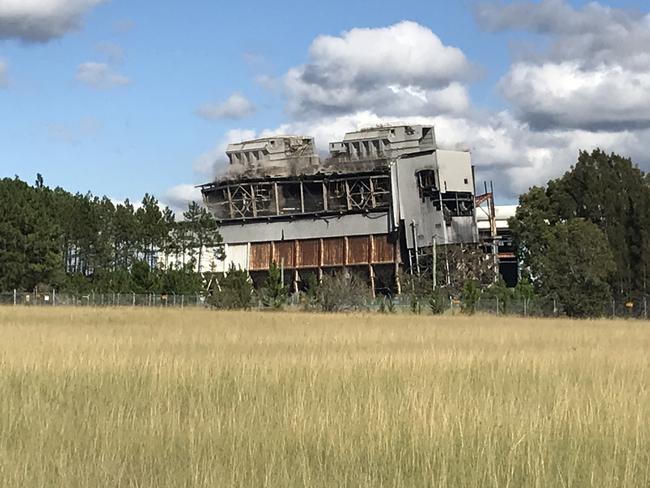 Going: Munmorah Power Station boilers and coal hopper complex begins to topple after the explosion.