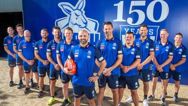 North Melbourne's coaching panel has undergone major change in the past 12 months. Shaw (centre) with coaching staff, from left: Heath Scotland, Michael Firrito, David Loader, Leigh Adams, Brendan Whitecross, Jason Lappin, Shaw, Jade Rawlings, Jarred Moore, Jared Rivers, Gavin Brown and Brent Harvey. Picture Jay Town