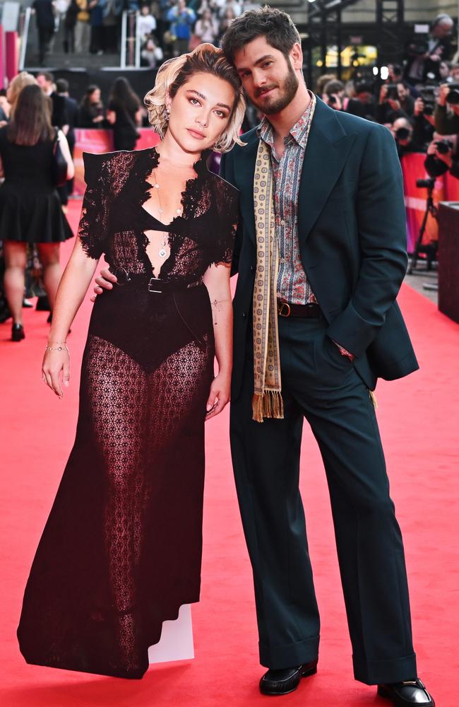 Newly single Andrew Garfield cuddles up to his cardboard co-star. Picture: Gareth Cattermole/Getty Images for BFI