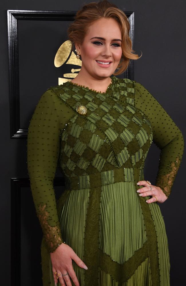 Adele wore this stunning green Givenchy dress to the 2017 Grammy Awards. AFP PHOTO / Mark Ralston