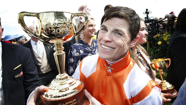 Winning Jockey Craig Williams holds the Melbourne Cup. Picture: David Caird