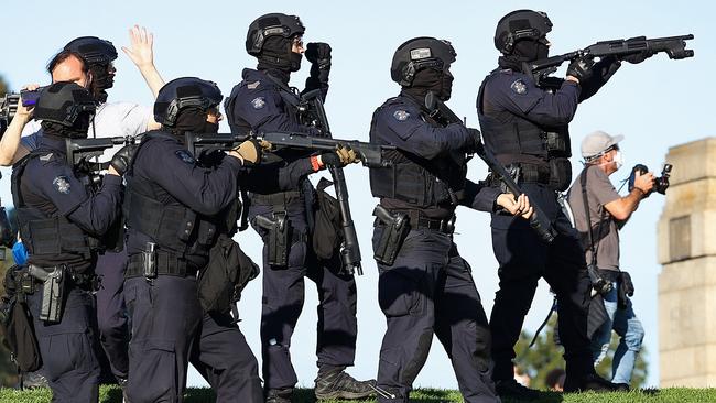 Police fire rubber bullets as protesters flee from the Shrine of Remembrance to protest anti-vaccination and lockdowns in Melbourne, in 2021. Picture: NCA NewsWire / Ian Currie