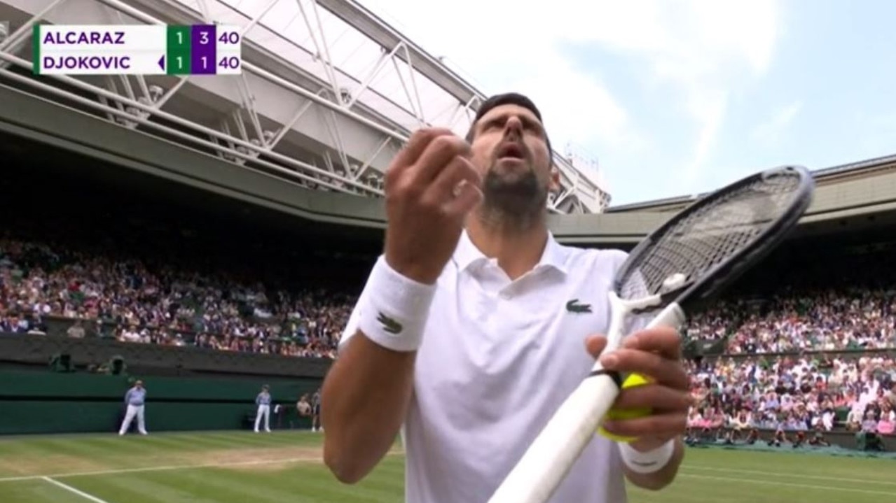 Novak Djokovic complains to the chair umpire.