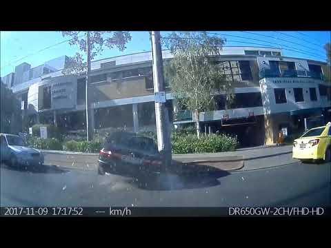 Elderly Driver Loses Control of Car, Smashing Into Parked Vehicle and Hospital Building. Credit - YouTube/Grant Fisher via Storyful