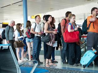 Check-in line at airport to board plane