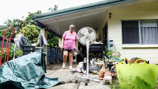 Vicky Mills clears out her house after it was inundated with floodwater from the Barron River. Picture: Brendan Radke