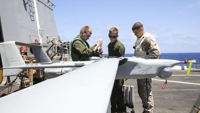 Marines putting together a RQ-21 Blackjack drone on the Mediterranean Sea. Photo: U.S. Navy/ Brent Pyfrom.