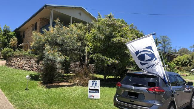 Photo taken by Kate Cornish of the sign and flag set up outside her Nambour house.