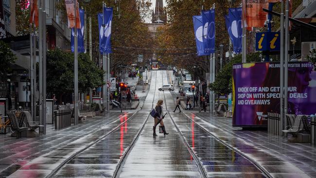 A near-deserted Bourke St in Melbourne on Thursday as the lockdown looms. Picture: Jake Nowakowski